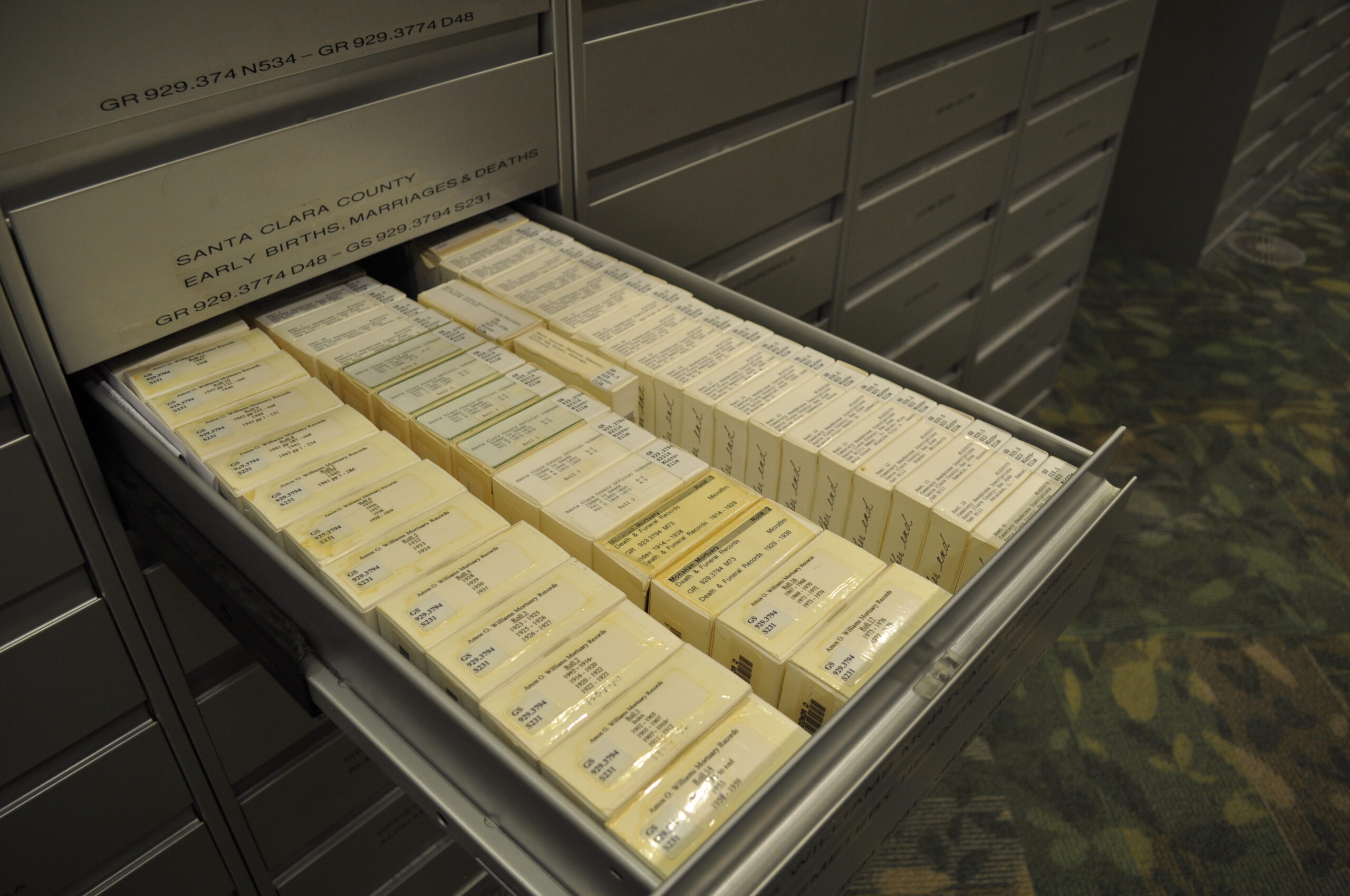 Microfilm boxes in a drawer.