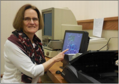 Reference Librarian at a computer